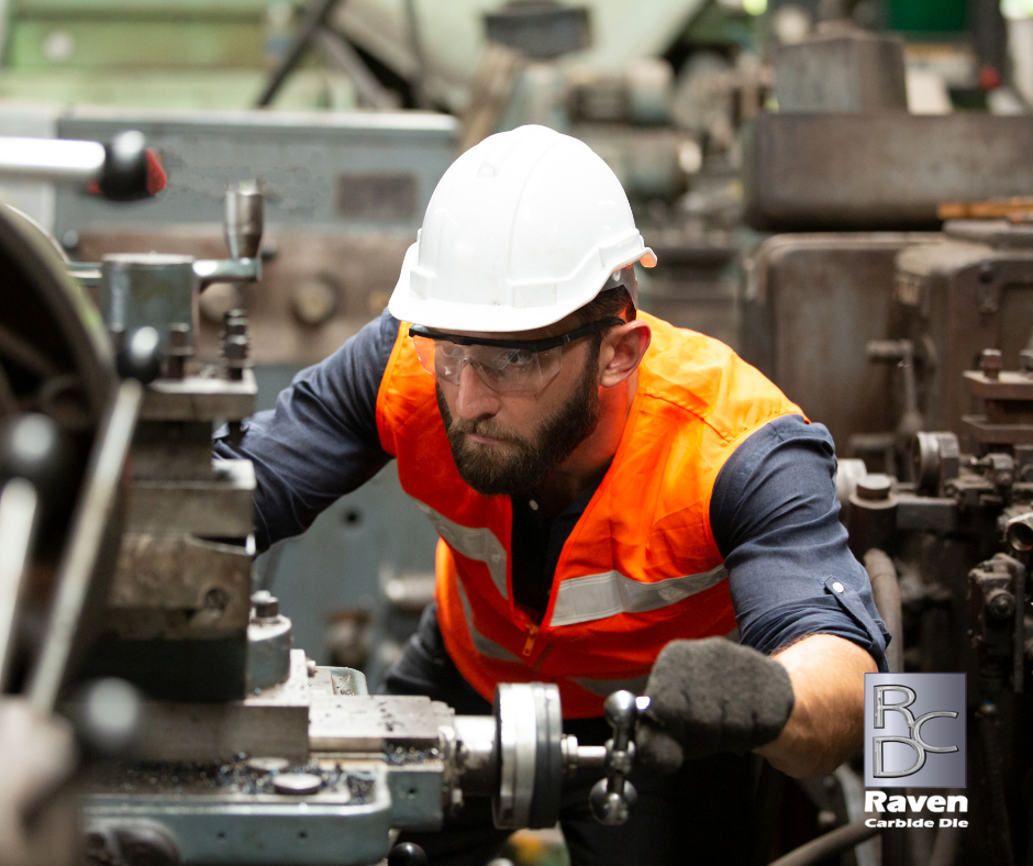 man in a defense factory using tungsten carbide dies